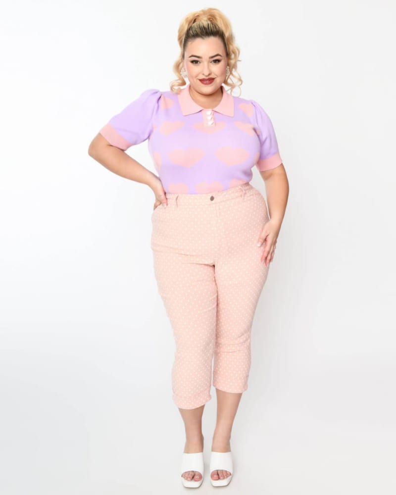 Front of a model wearing a size XL Unique Vintage Pink & White Pin Dot Heart Pocket Rachelle Capri Pants in Pink & White Pin Dot by Unique Vintage. | dia_product_style_image_id:325162